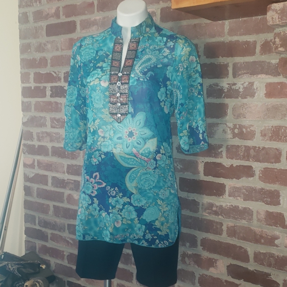 **Brand new** Teal green blouse with floral print.